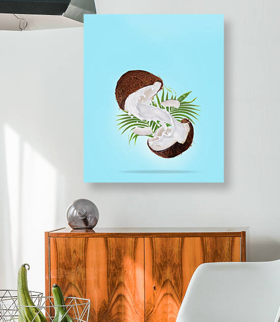 Sliced falling coconut with splash of milk  by Tamer Mallak