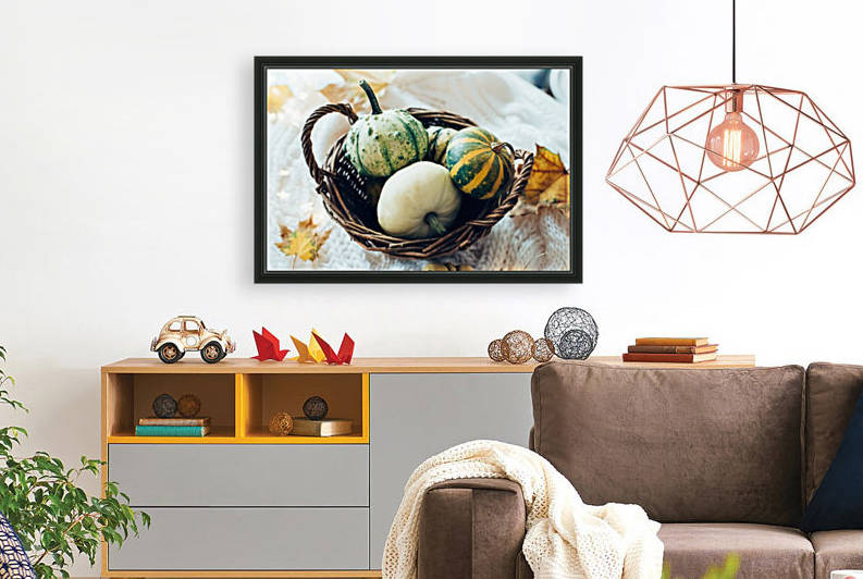 Three pumpkins in a basket by Daria Minaeva