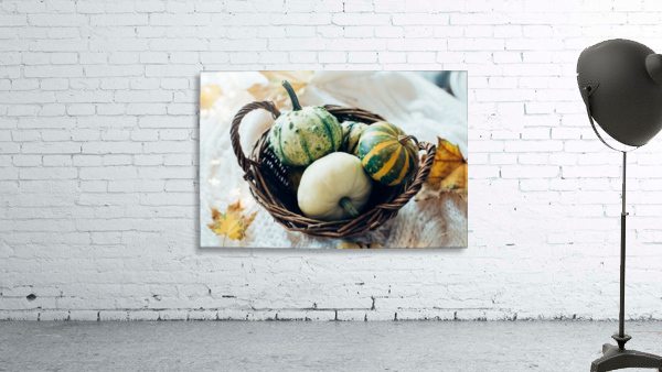 Three pumpkins in a basket Wall Preview
