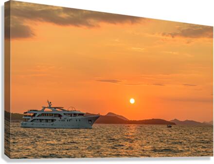 Ship sailing at sunset Canvas Print