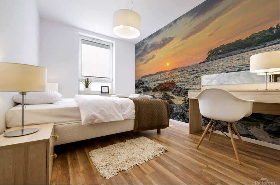 Sunset over rocky beach Mural print