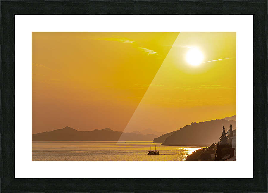 Sunset over coastline Picture Frame print