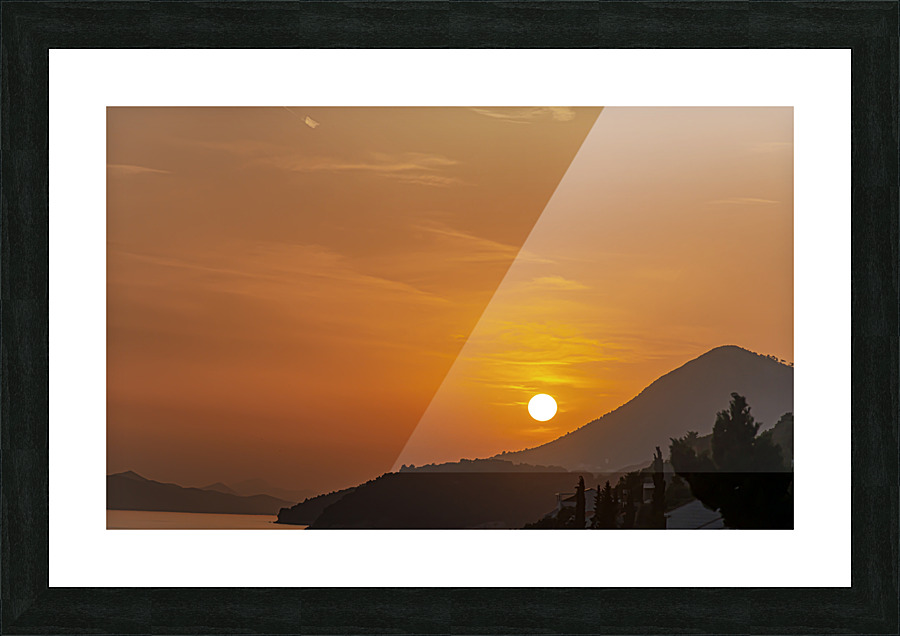 Sunset over coastline Picture Frame print