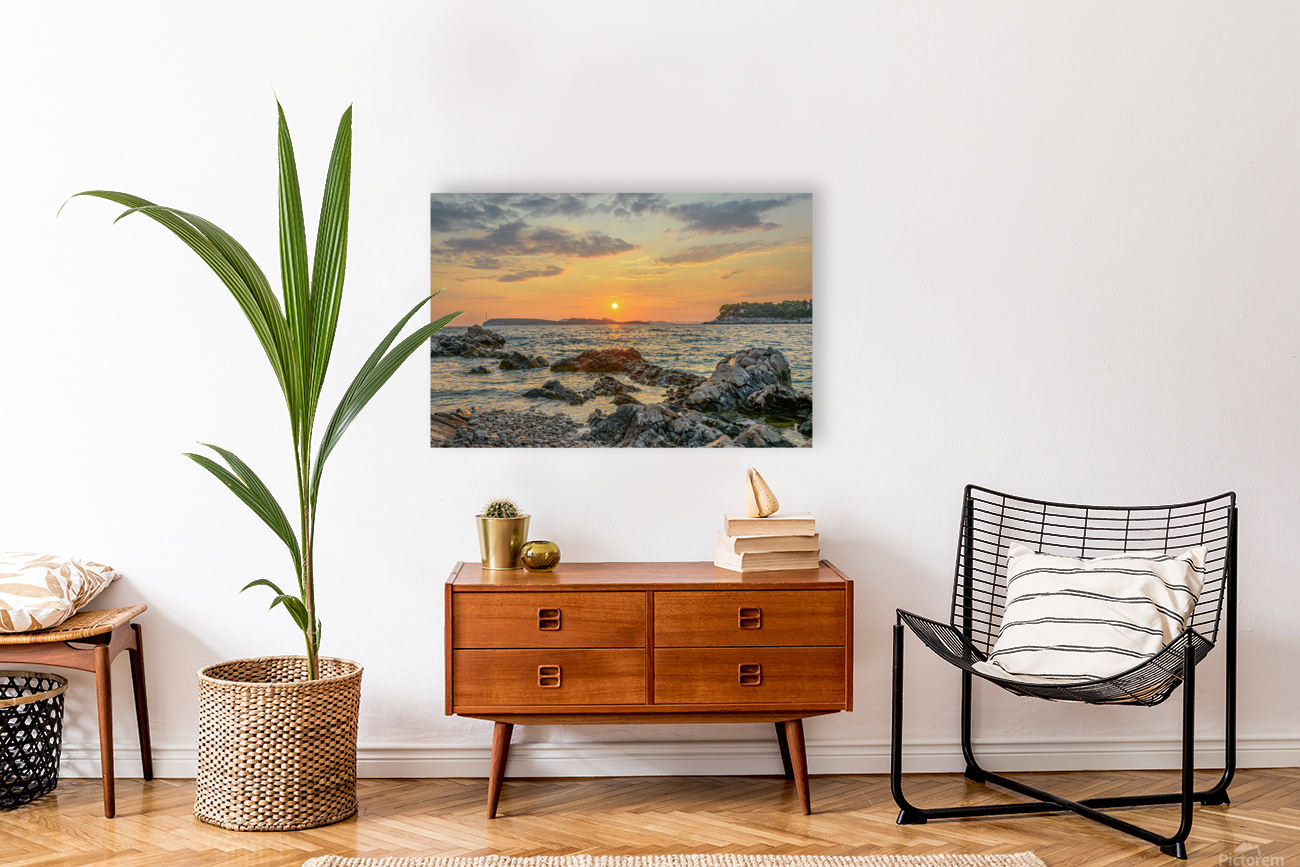 Sunset over rocky beach Reproduction