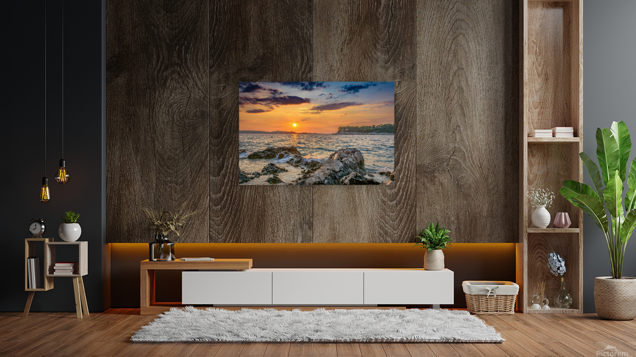 Sunset over rocky beach Reproduction
