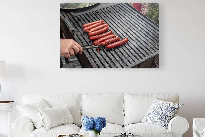 Frying sausages by Vedad Ceric