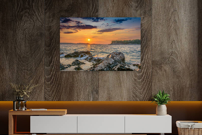 Sunset over rocky beach by Vedad Ceric
