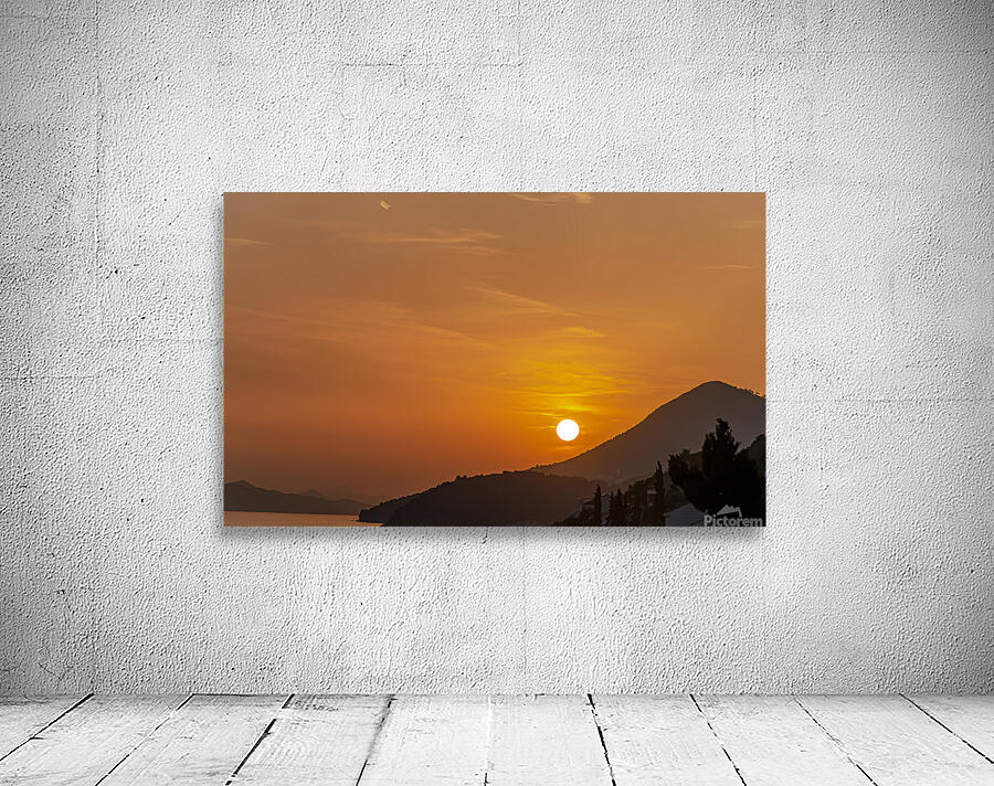 Sunset over coastline Wall Preview