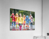 A Group of Children Playing in the Rain Jumping in Puddles Acrylic Print