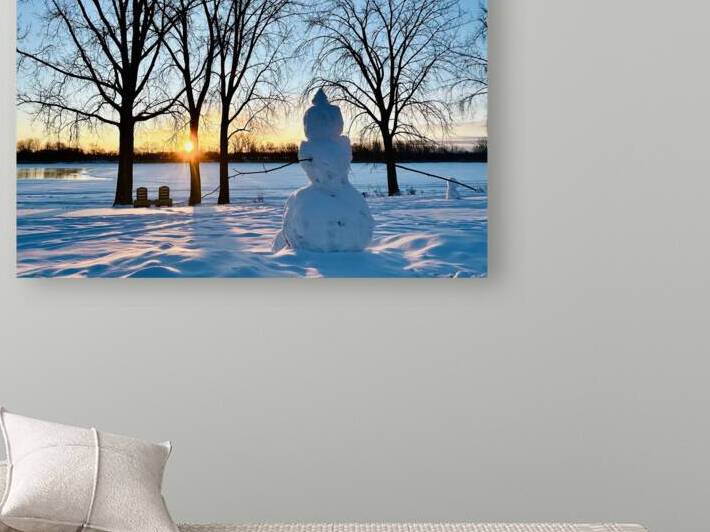 Sunrise over a snowman by Genevieve Gagnon