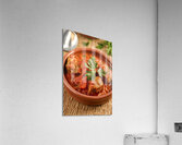 A rustic setting with a clay bowl containing a ri Acrylic Print