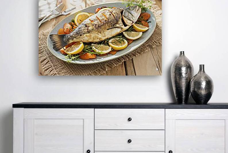 A plate of grilled or baked fish presented on a r by Romeu Hurmuzache