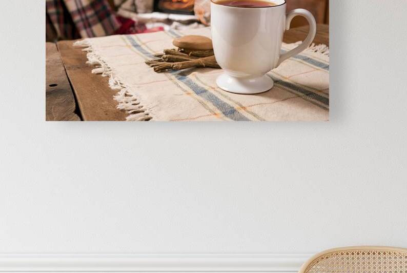 A rustic setting with a white ceramic mug filled by Romeu Hurmuzache