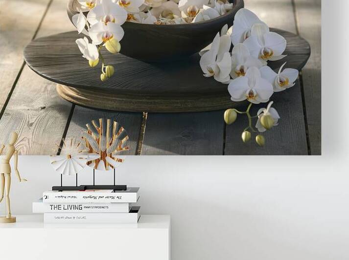 A serene setting with a dark wooden bowl containi by Romeu Hurmuzache