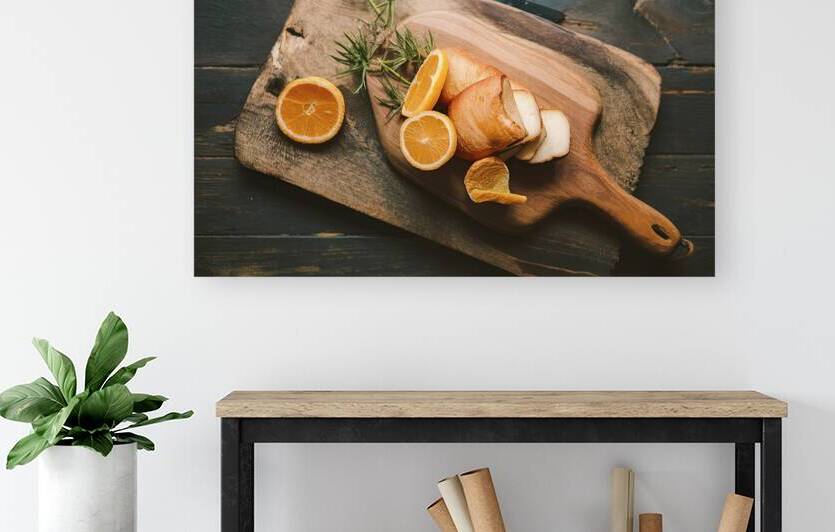 A wooden cutting board on a dark wooden surface 2 by Romeu Hurmuzache