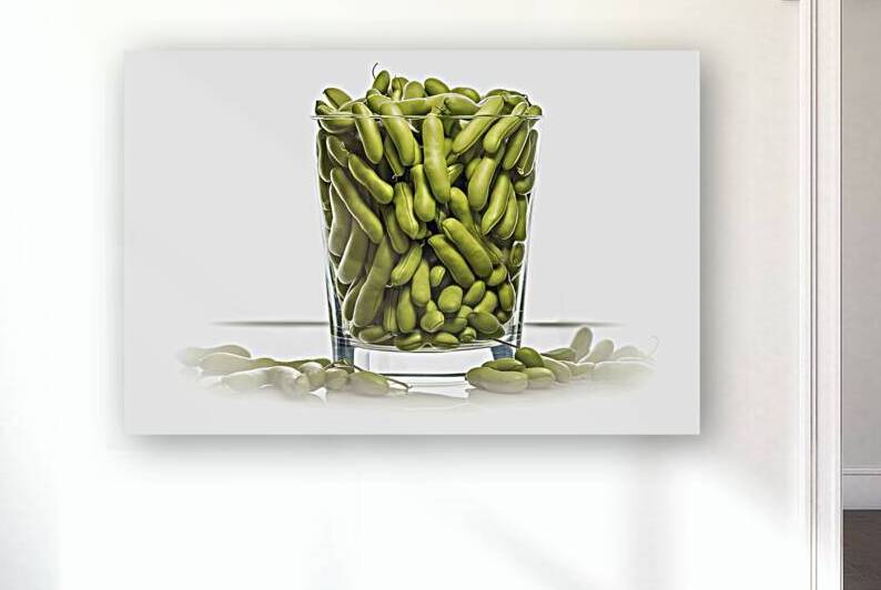 A clear glass filled to the brim with green fresh by Romeu Hurmuzache