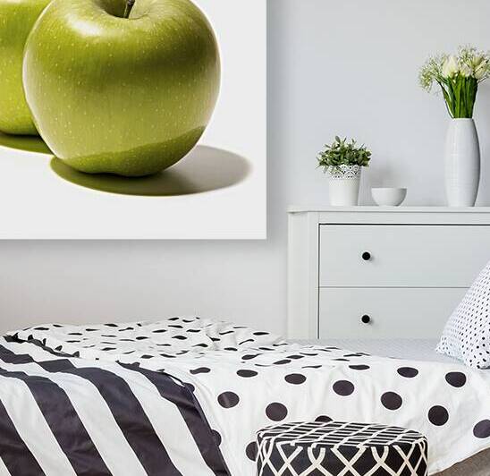 Two fresh green apples placed side by side on a w by Romeu Hurmuzache