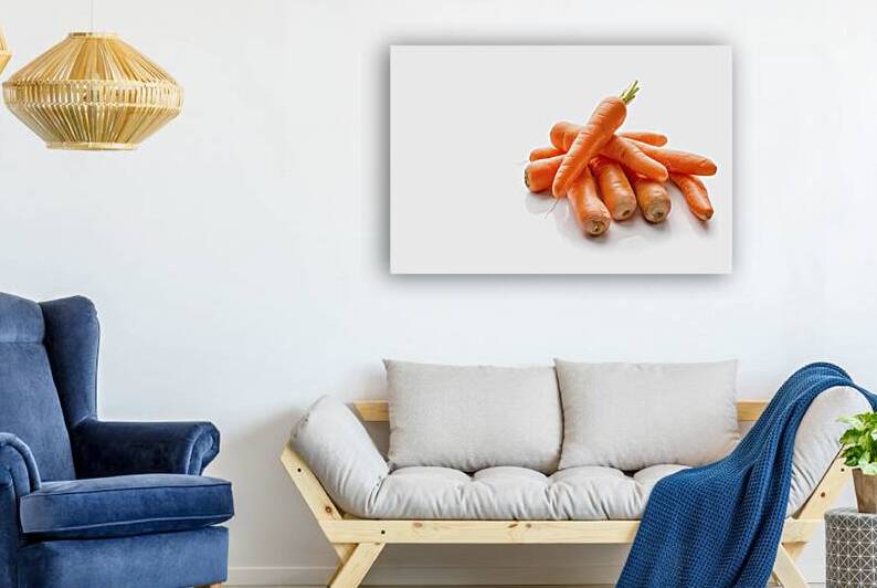 baby carrots on white background 2 by Romeu Hurmuzache