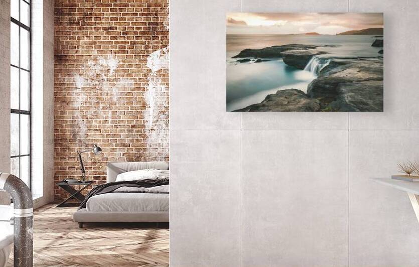 A series of rock formations jut out into the sea by Romeu Hurmuzache