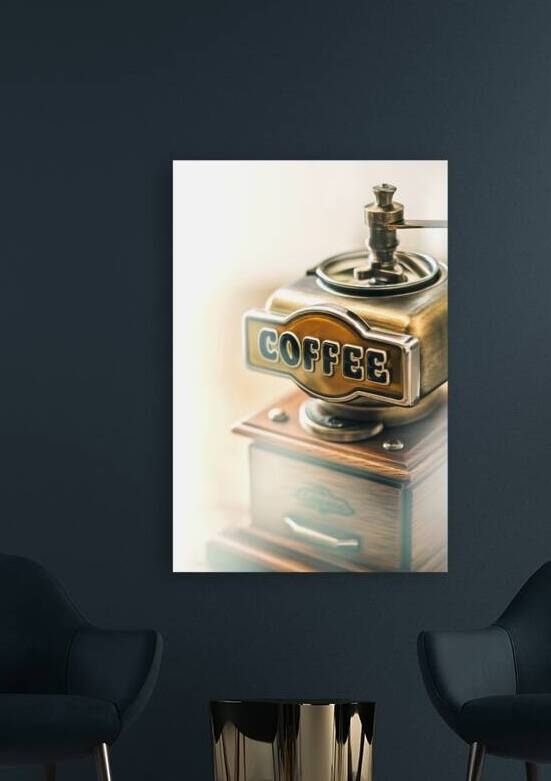A vintage coffee grinder with a metallic finish a by Romeu Hurmuzache