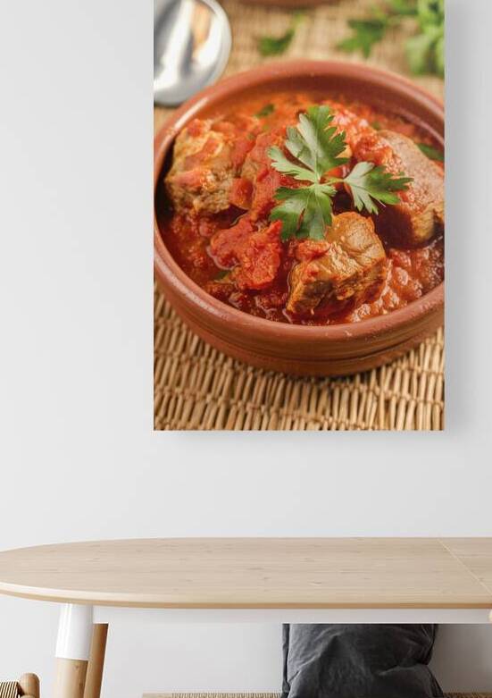 A rustic setting with a clay bowl containing a ri by Romeu Hurmuzache