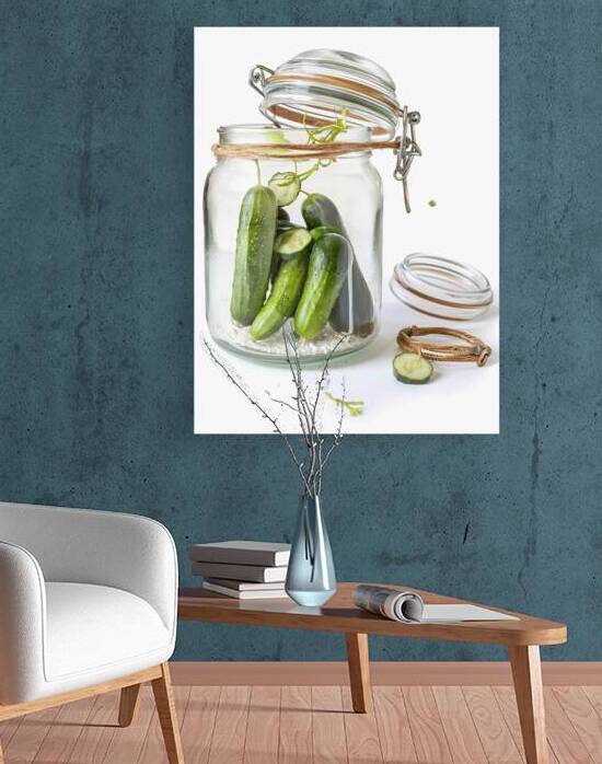 A clear glass jar filled with green cucumbers 3.j by Romeu Hurmuzache