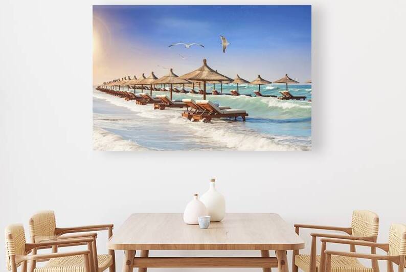 A pristine beach with multiple wooden sun lounger by Romeu Hurmuzache