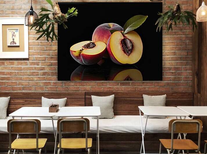 A freshly cut peach with its juicy yellow flesh e by Romeu Hurmuzache