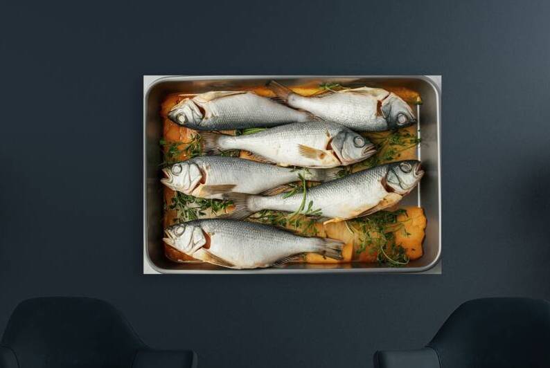 A rectangular baking tray filled with fresh fish by Romeu Hurmuzache