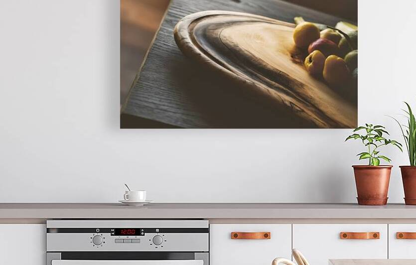 A wooden cutting board on a dark wooden surface 3 by Romeu Hurmuzache