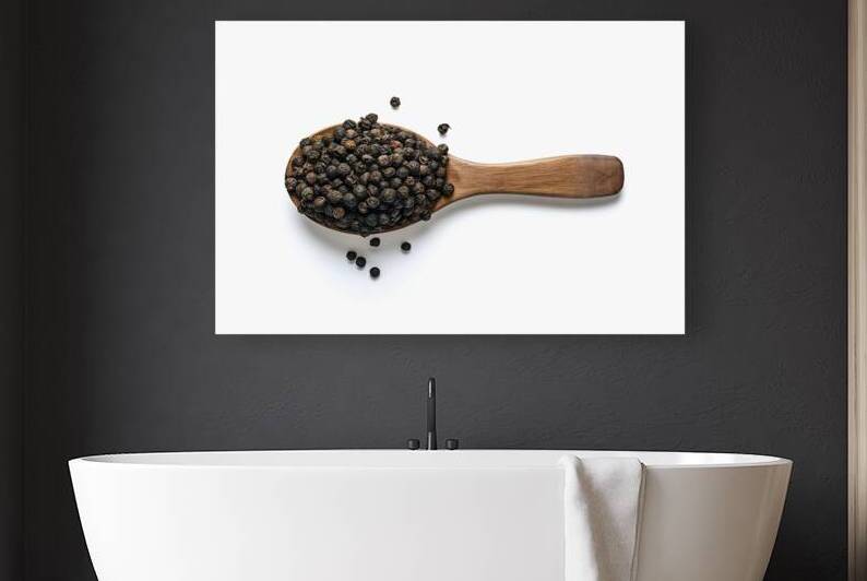 black peppers on wood spoon isolated on white bac by Romeu Hurmuzache