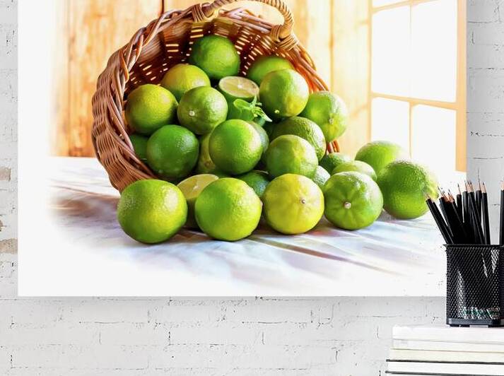 A wicker basket filled with green limes 3 by Romeu Hurmuzache