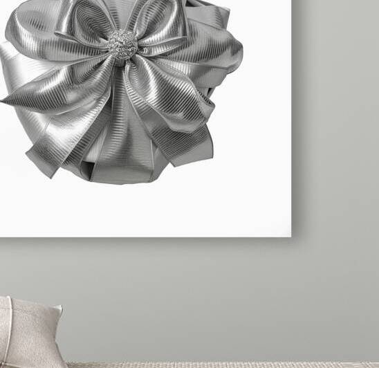 Silver glossy ribbon bow gift isolated on white b by Romeu Hurmuzache