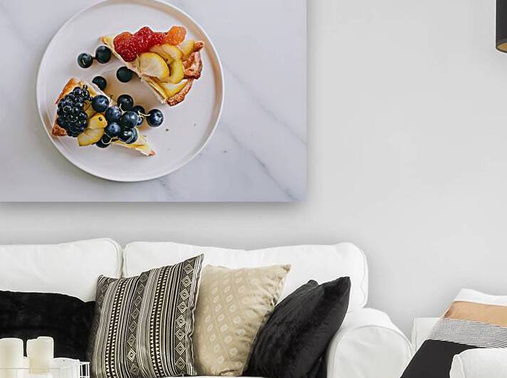 Two slices of fruit topped pastries placed on a w 1722094538.3223 by Romeu Hurmuzache
