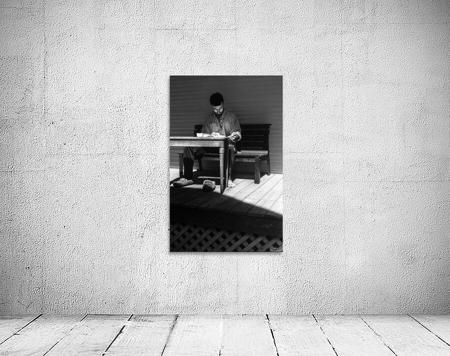 Man Reading In Shadow Wall Preview