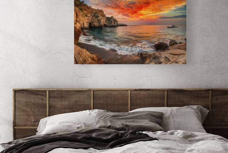 The stone coast features rug ged cliffs and rock by Stoica Lilian