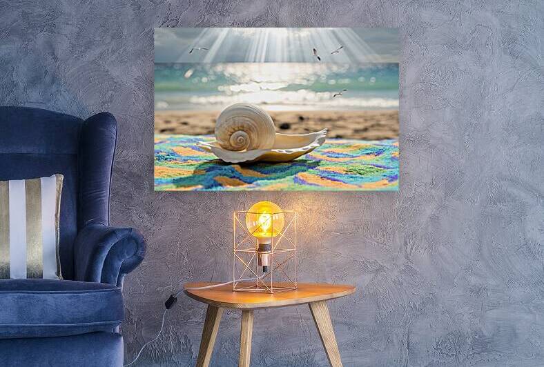 A shell on towel in sunshine with blurred sea on by Stoica Lilian