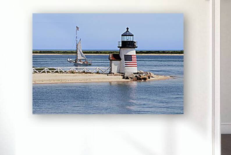 Sailboat Passes Brant Point Lighthouse on Nantucket Harbor in Massachusetts by Allan Wood