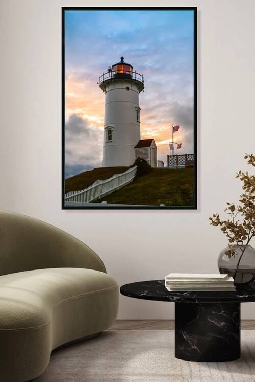Sun Setting Behind Flashing Nobska Light Tower on Cape Cod in Massachusetts by Allan Wood