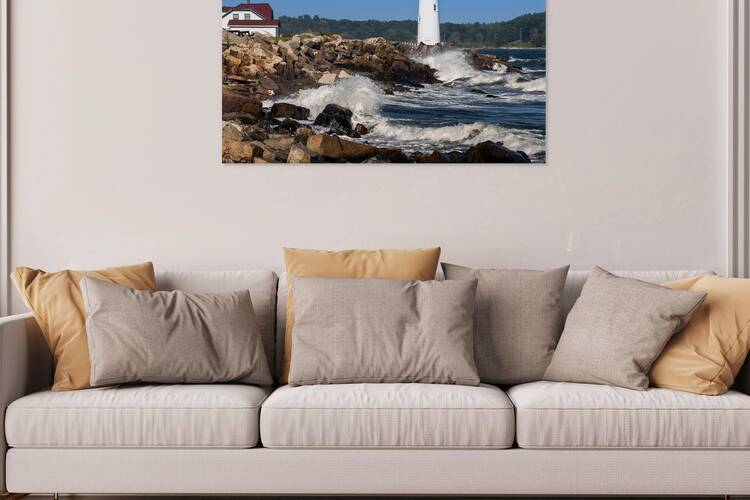 Breaking Waves by Portsmouth Harbor Light along rocky shoreline in New Hampshire by Allan Wood