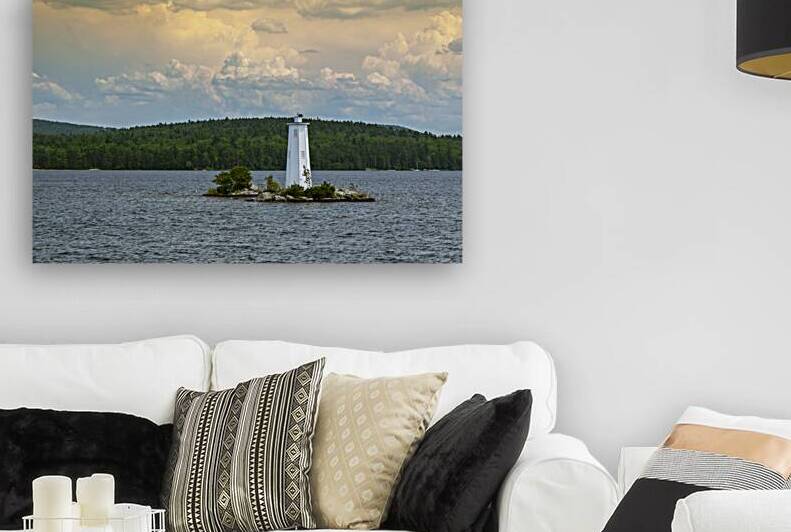 Sunlit Clouds Over Loon Island Light on Lake Sunapee in New Hampshire by Allan Wood