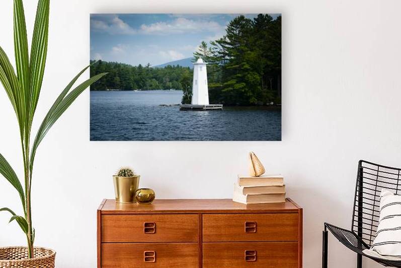 Herrick Cove Light by Rocky Shoreline of Lake Sunapee in New Hampshire by Allan Wood