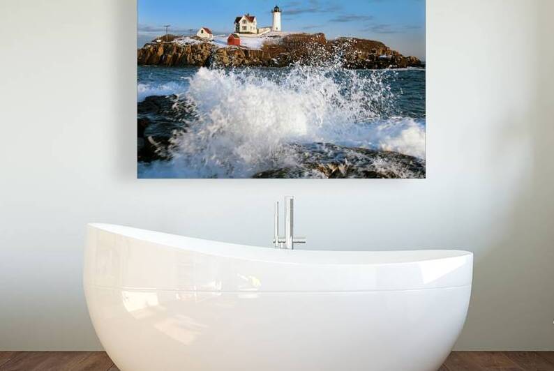 Waves Crashing Over Rocks by Cape Neddick Nubble Lighthouse During the Holidays in Maine by Allan Wood