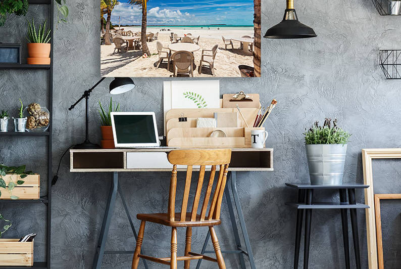 Tables and chairs on the beach by Jo Ann Snover