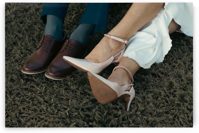 Bride and Groom Wedding Shoes Resting on the Grass by Bruno Dias
