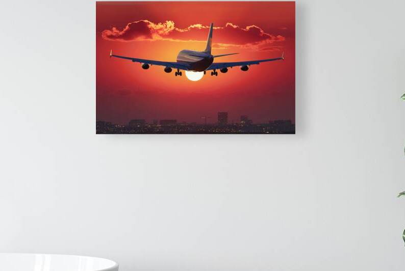 Airplane at sunset   back lit by Marius Tomus