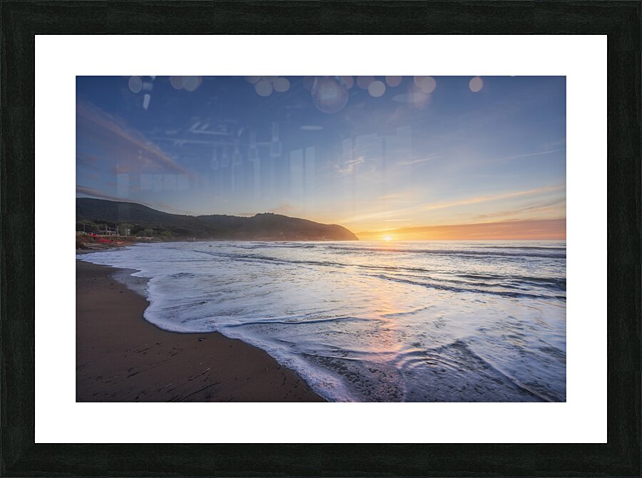 Waves on the Baratti beach at sunset. Tuscany Italy Picture Frame print