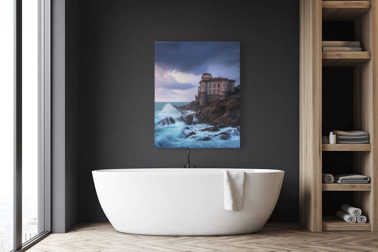 Boccale castle on the rocks and rough sea. Italy Reproduction