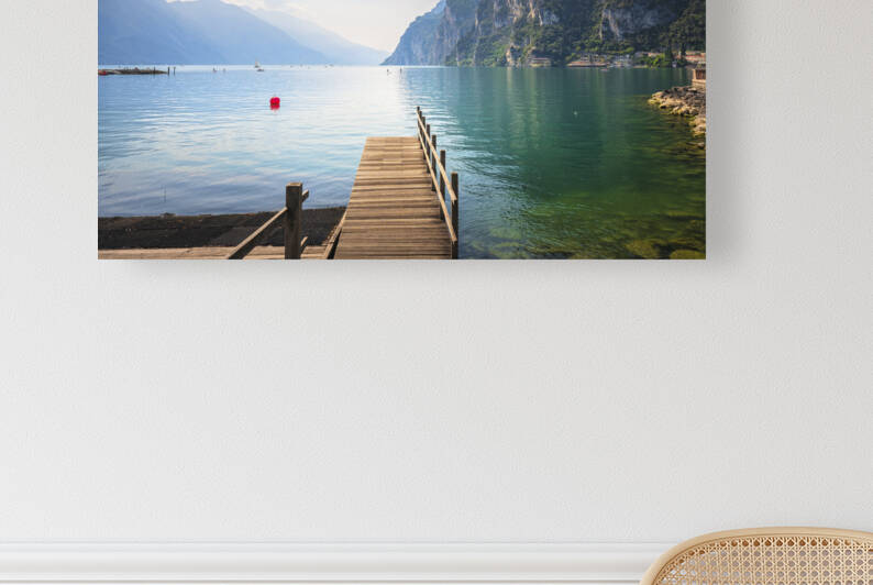 Wooden pier on the lake. Riva del Garda Italy by Stefano Orazzini