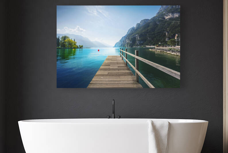 Wooden pier on the lake. Riva del Garda Italy by Stefano Orazzini